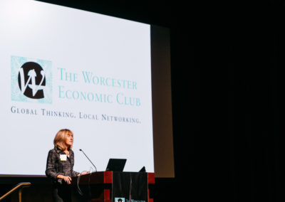 Tracy Barlok, Vice President of Advancement at Holy Cross, addresses members of the Worcester Economic Club.